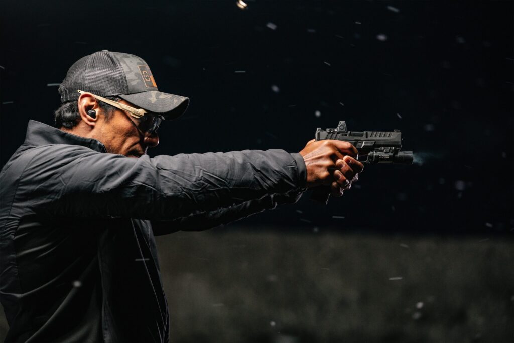 Man shooting in darkness
