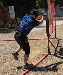 man shooting pistol in competition