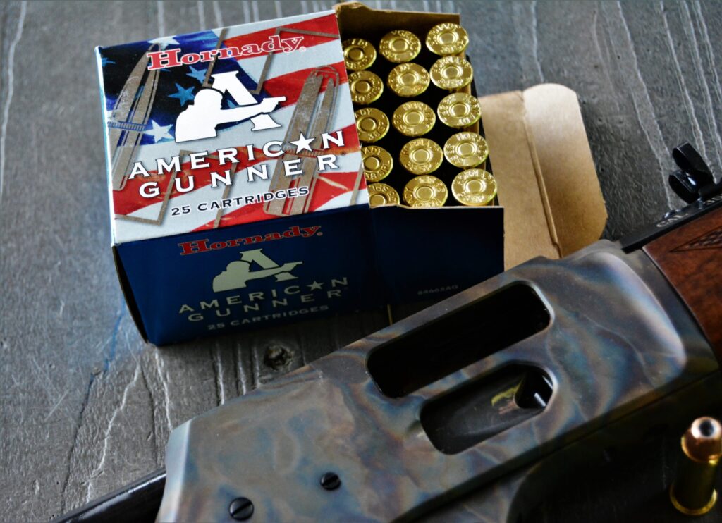 rifle on bench with ammunition