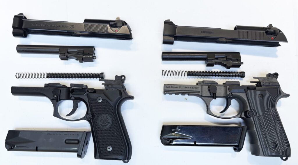 Disassembled pistols side by side for comparison