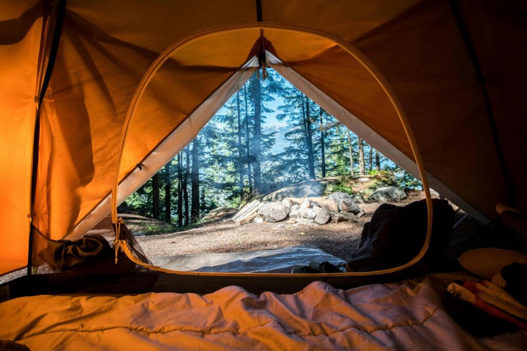 inside a tent looking out into nature