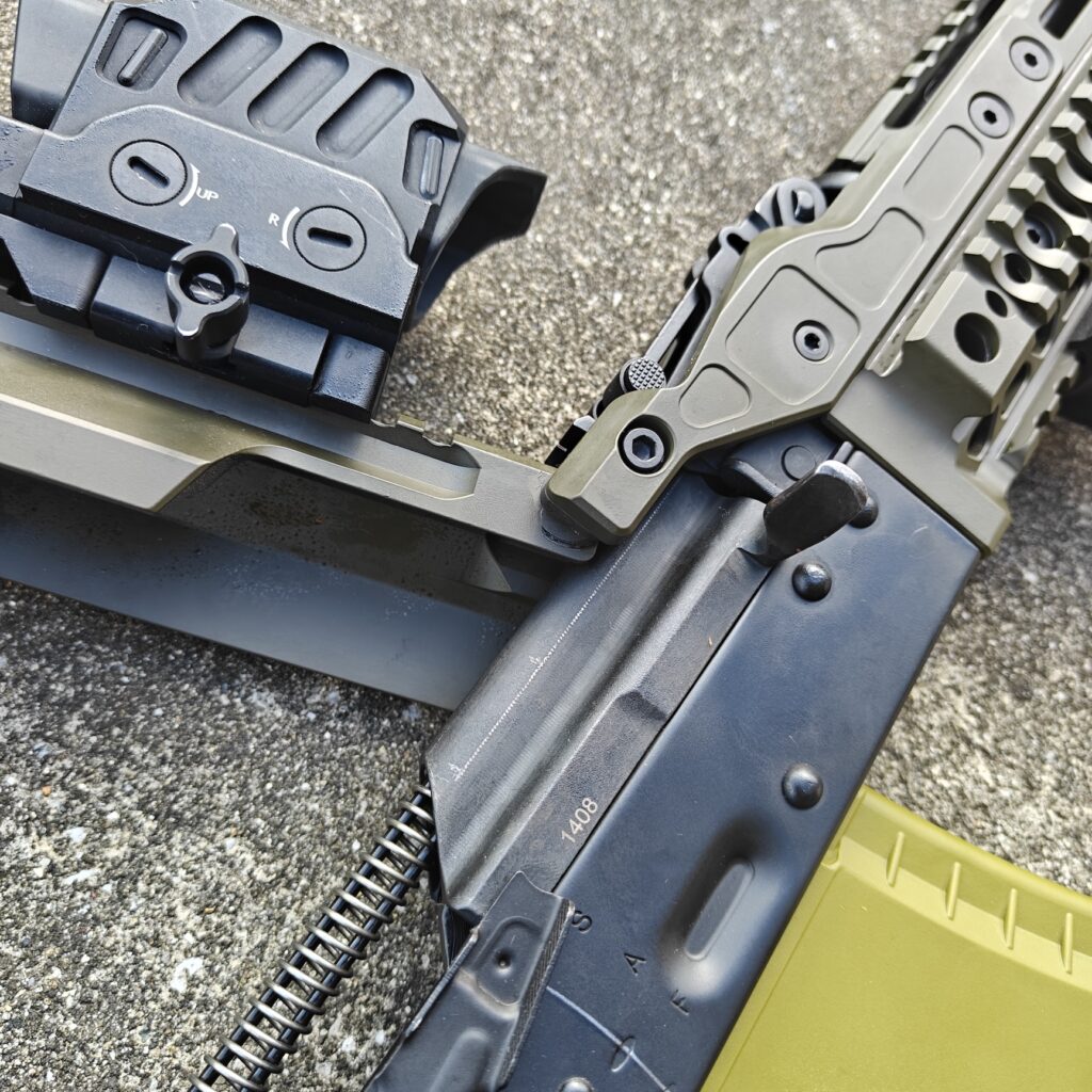 open top of rifle on concrete