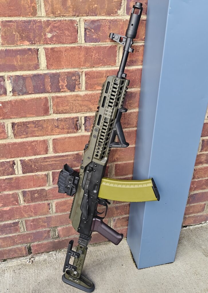 rifle leaning on wall