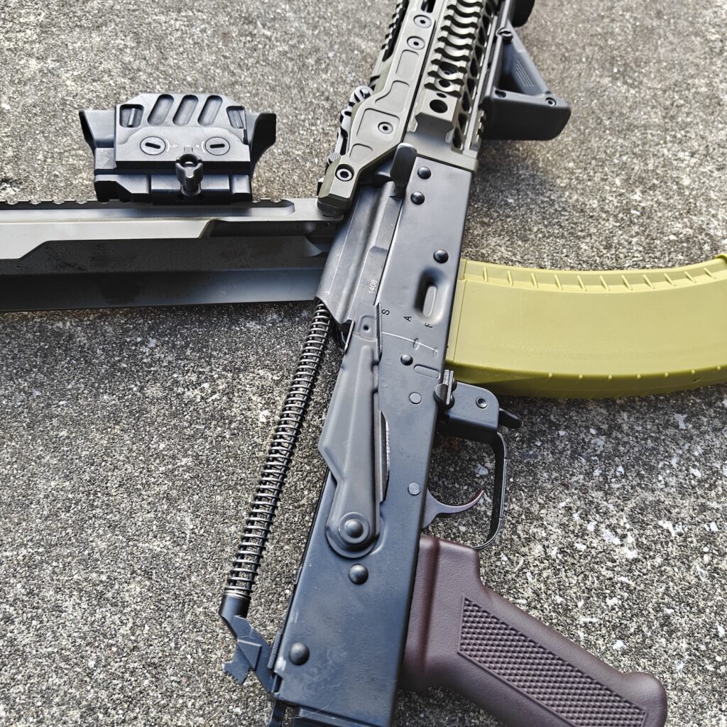 top open rifle on concrete