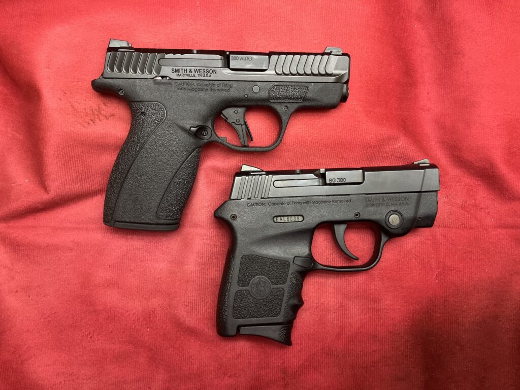 two pistols with red backfrop
