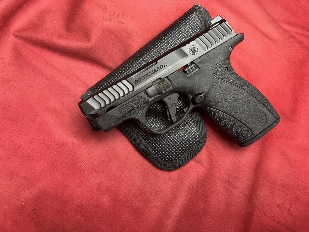 pistol resting on holster
