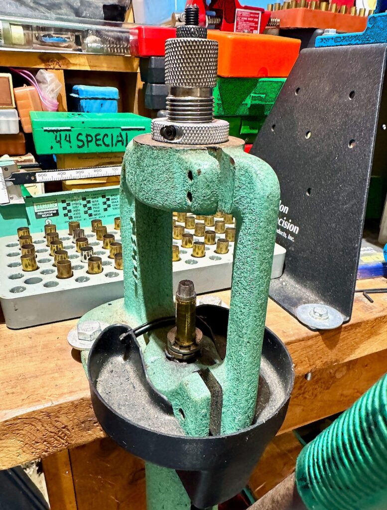 reloading press mounted on bench