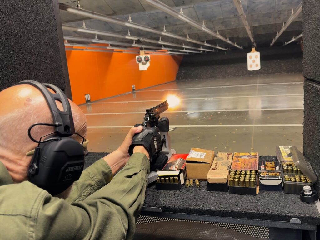 man in gun range shooting revolver