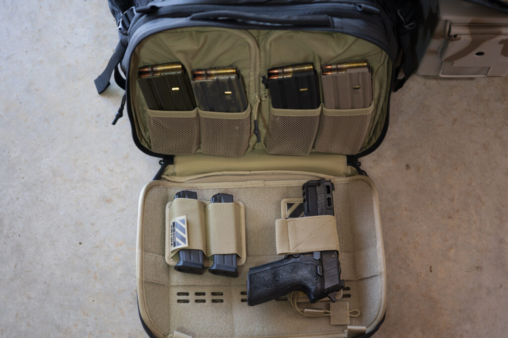Bag open showing tan interior and magazines